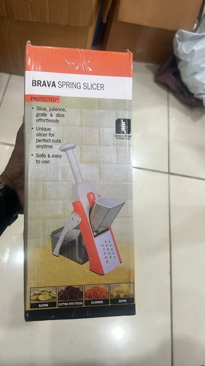 Orange and white Safe-Slice adjustable mandoline slicer